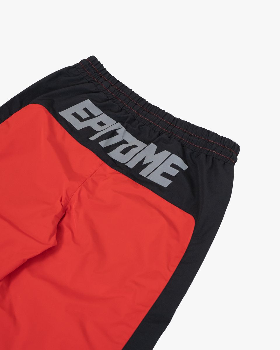 Red and black shorts with 'EPITOME' branding on a white background