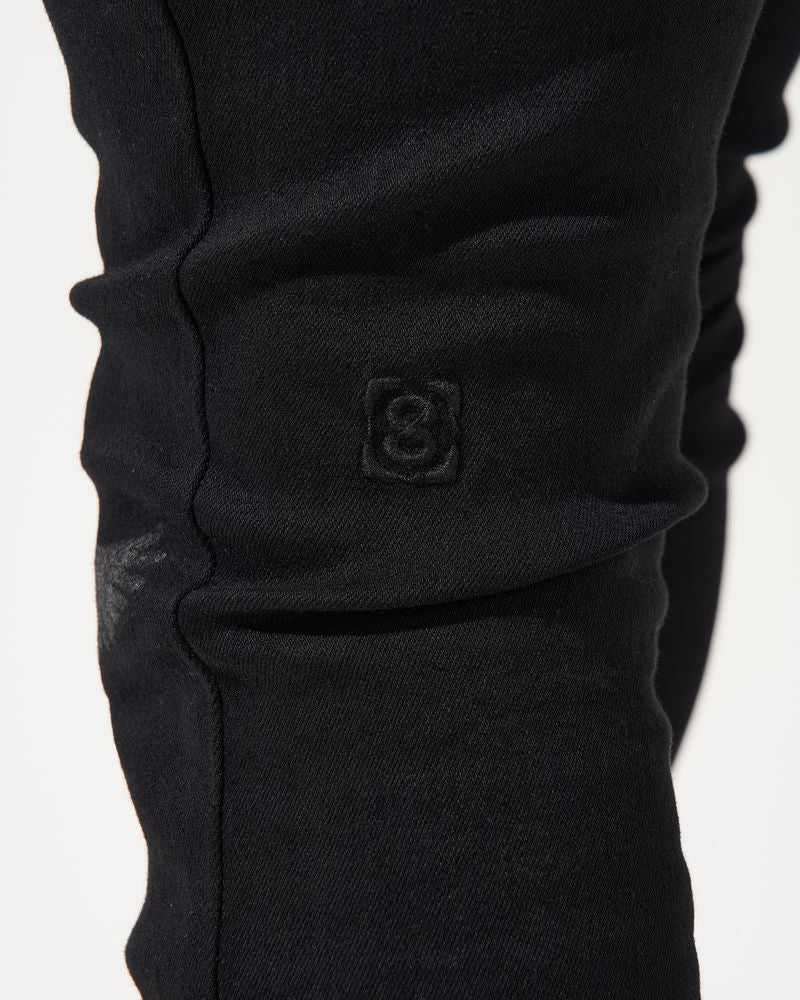 Close-up of a black garment on a white background