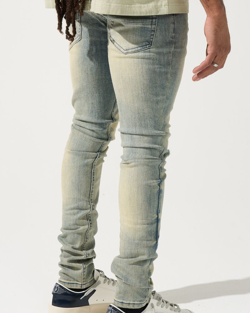 Light blue jeans worn by a person on a white background