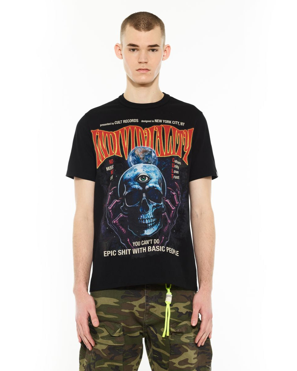 Person wearing a black t-shirt with a graphic design and text on a white background