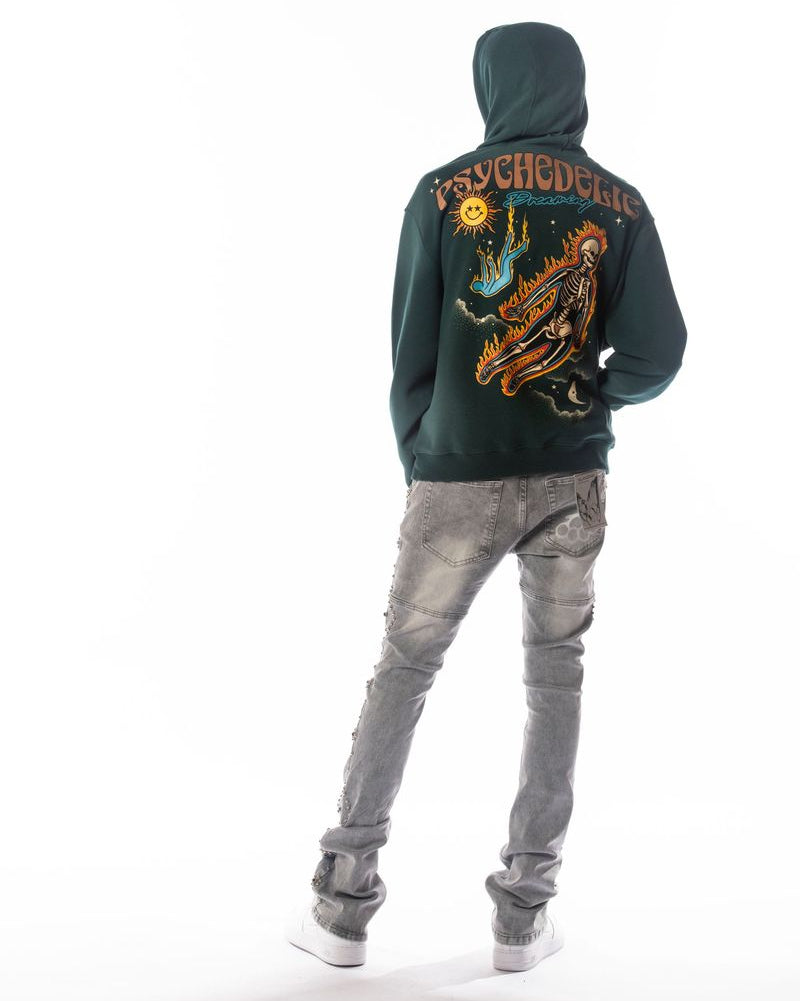 Person wearing a green hoodie with a colorful design on the back, standing against a white background
