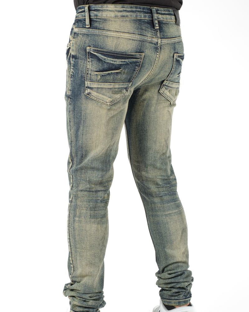 Blue jeans worn by a person on a white background