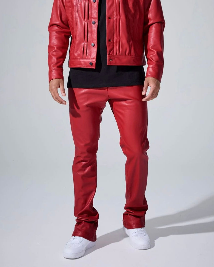 Person wearing a red leather jacket and pants with white shoes on a light gray background