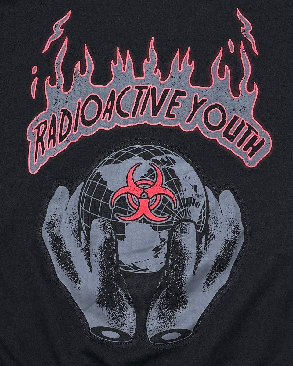 Black t-shirt with 'Radioactive Youth' design featuring flames, a globe with a biohazard symbol, and hands holding the globe.