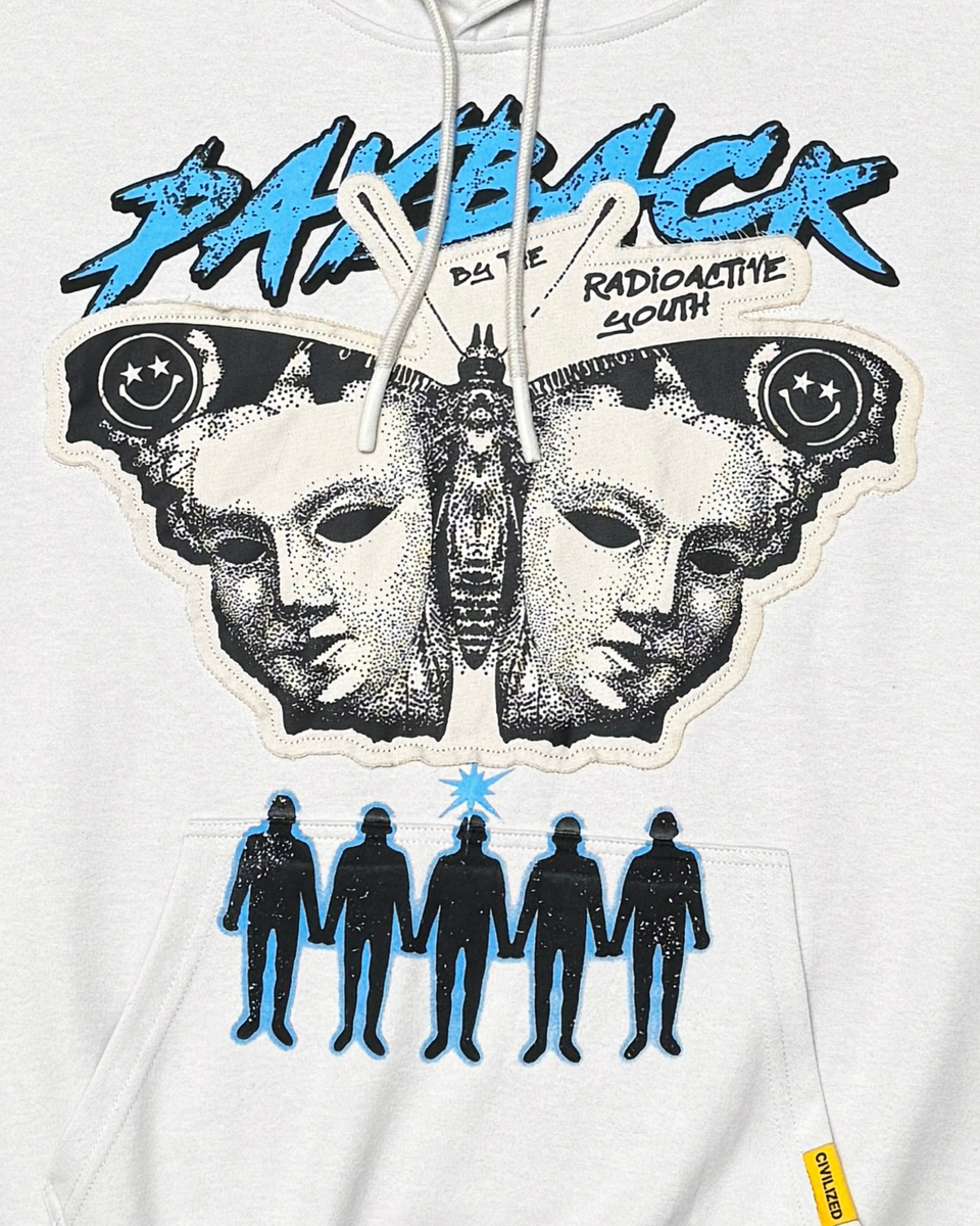 White hoodie with graphic design featuring faces, figures, and text on a white background