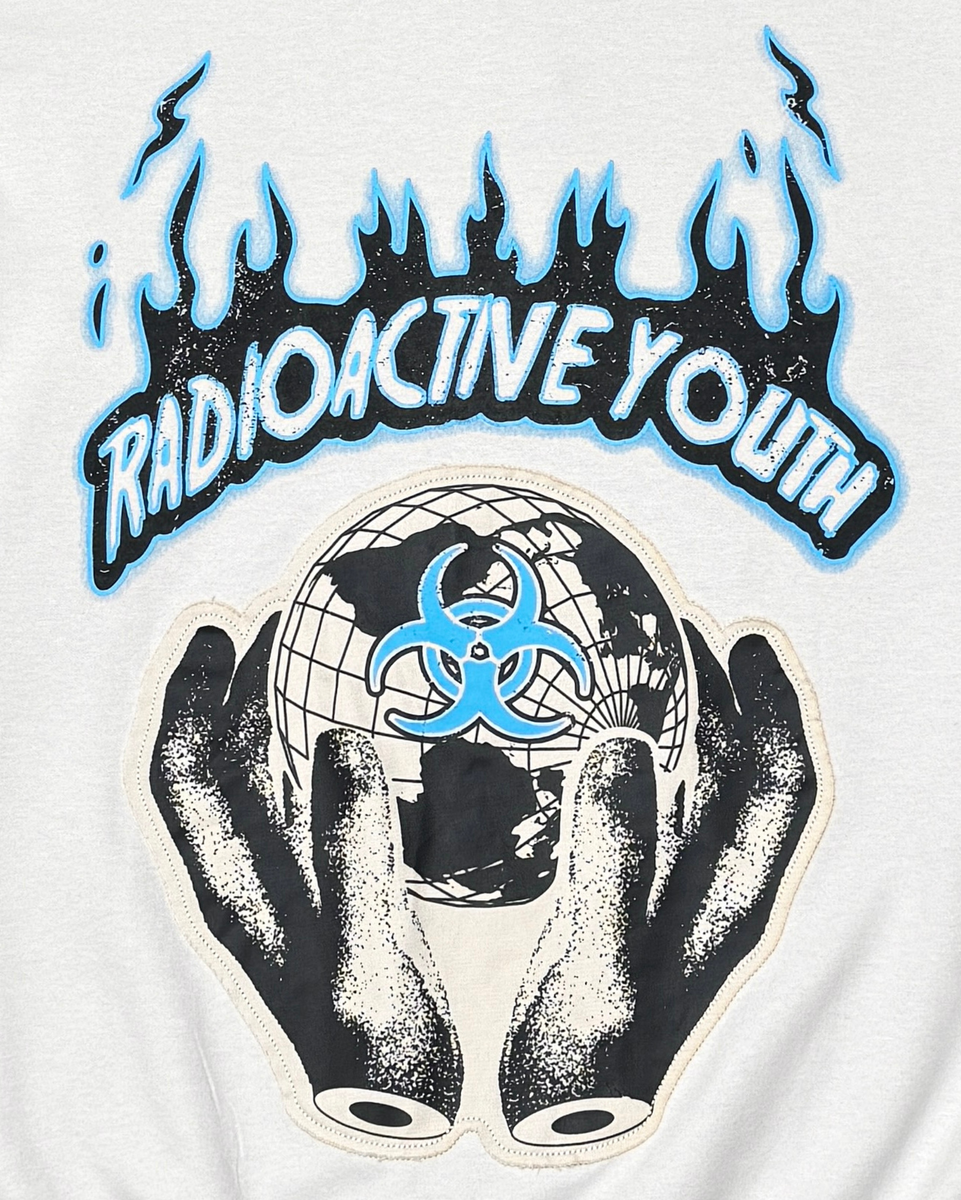 White t-shirt with 'Radioactive Youth' graphic design featuring hands holding a globe with a biohazard symbol.