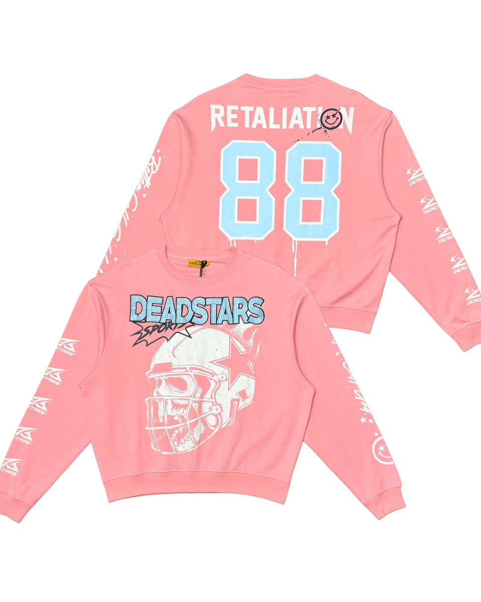 Pink long-sleeve shirt with graphics and text on a white background