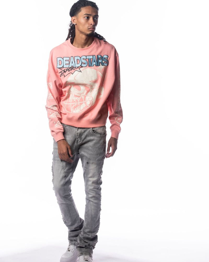 Person wearing a pink 'DEADSTARS' sweatshirt and gray pants on a white background