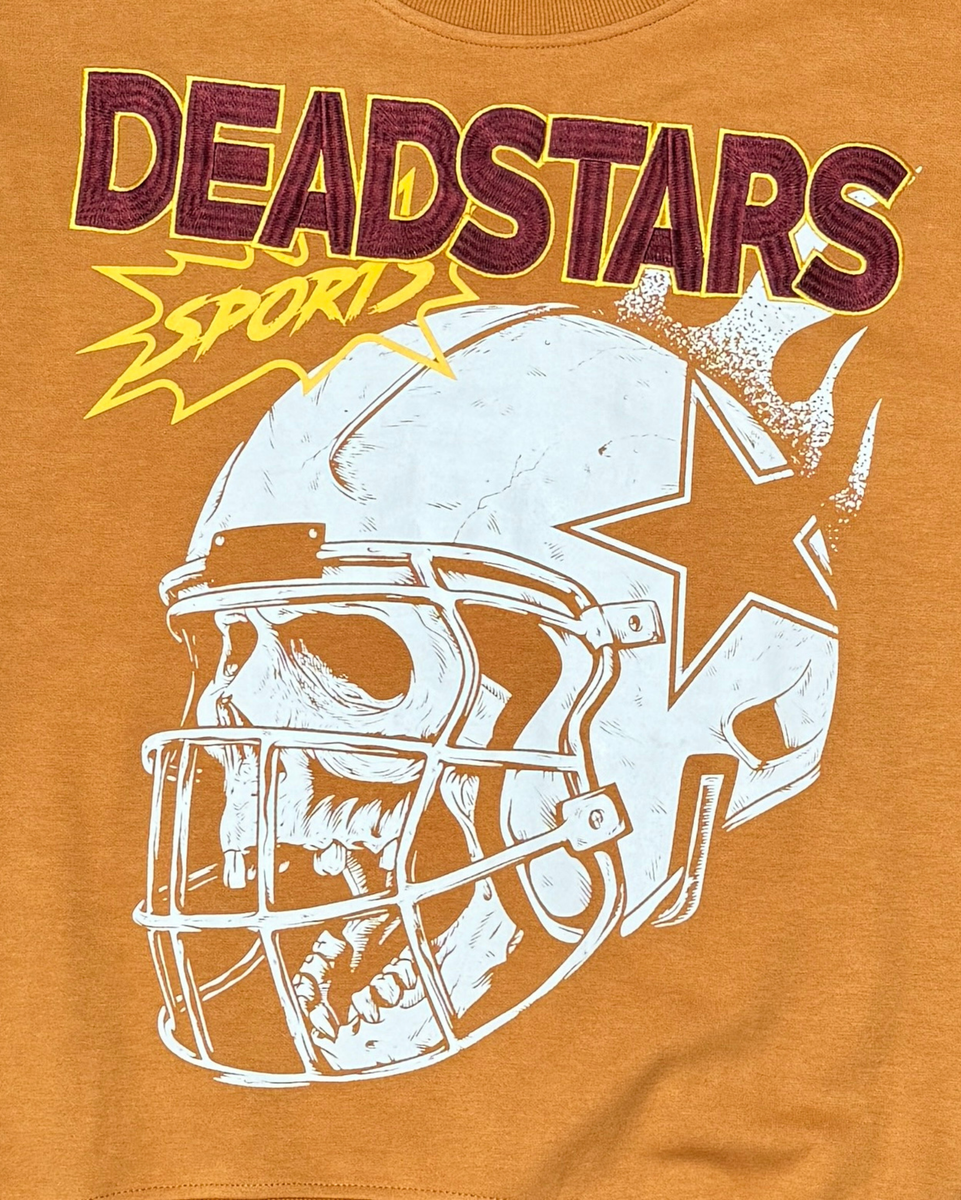 Orange t-shirt with a football helmet and star design and 'DEADSTARS SPORT' text.