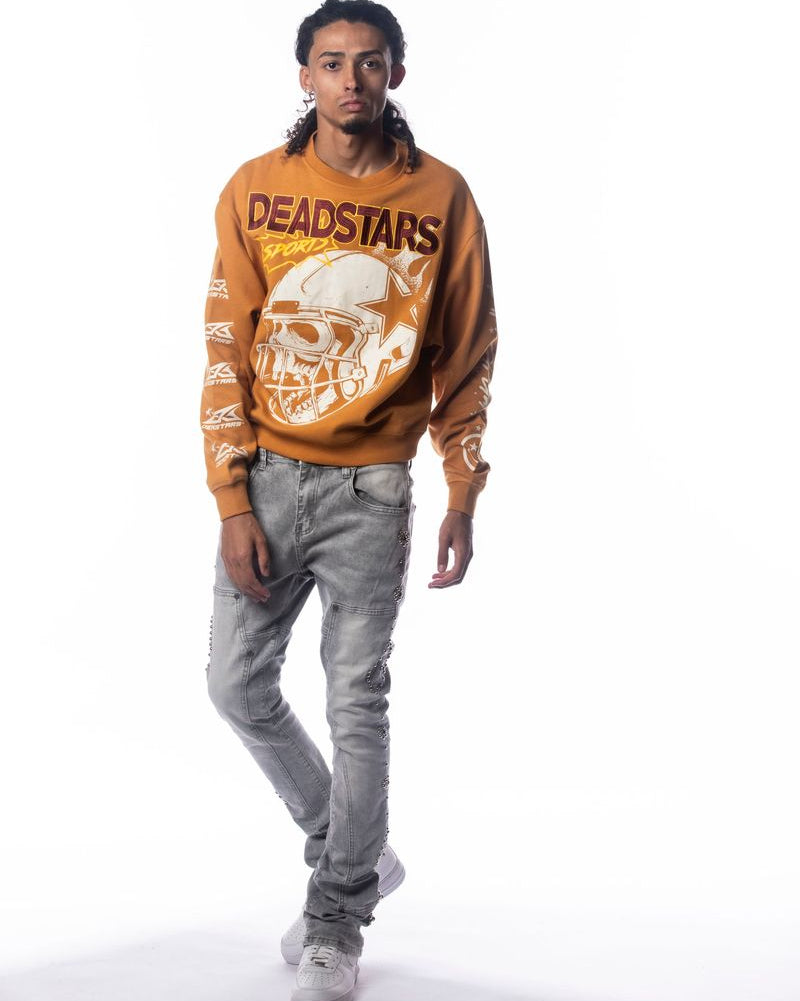 Person wearing a brown 'DEADSTARS' sweatshirt with a helmet graphic on a white background