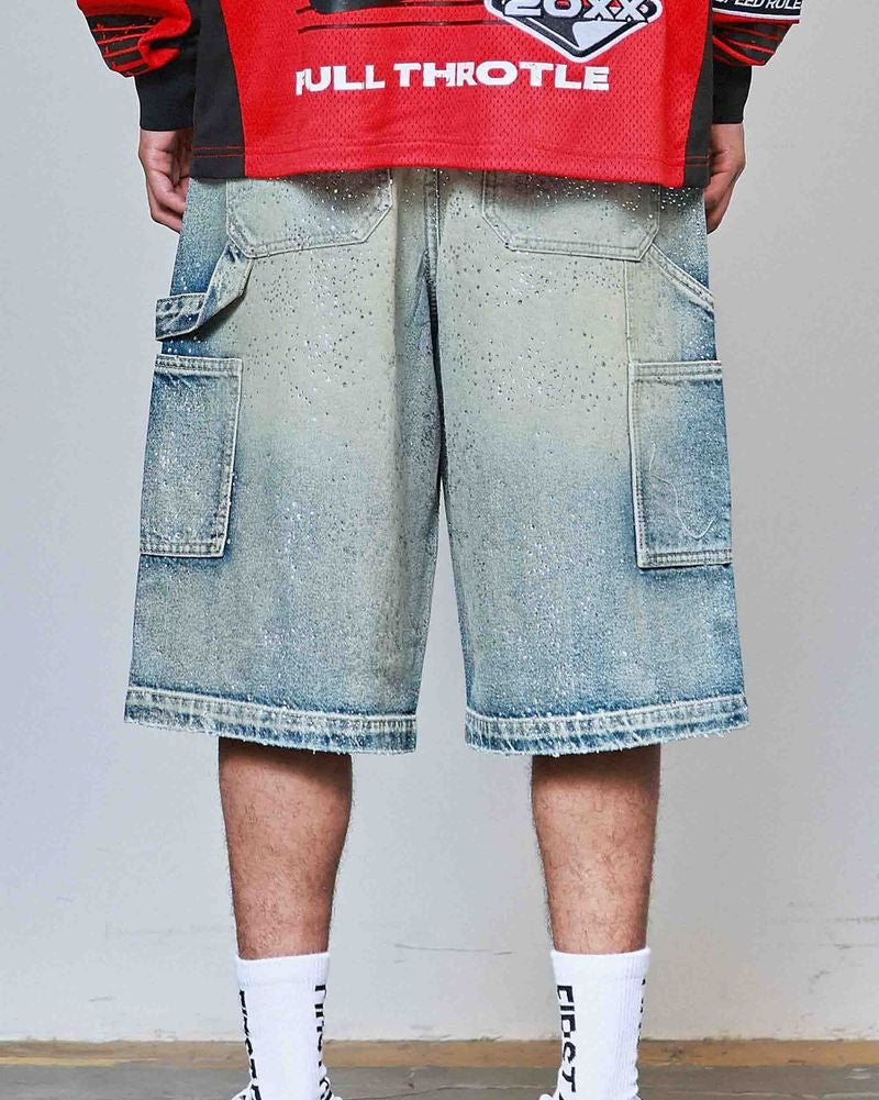 Person wearing a red jacket with 'Full Throttle' branding, blue denim shorts, and white sneakers on a plain background.