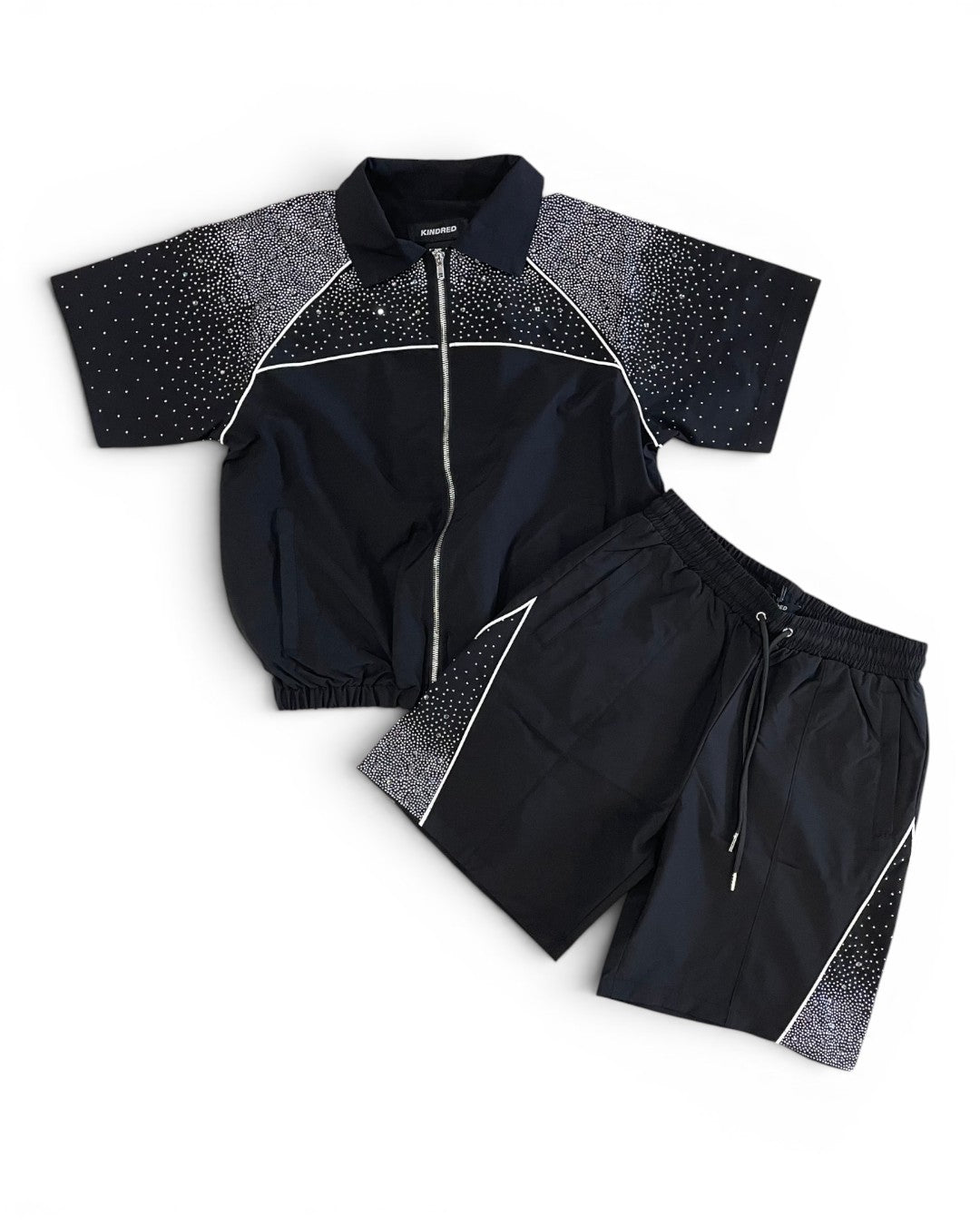Black jacket and shorts set with star pattern on a white background