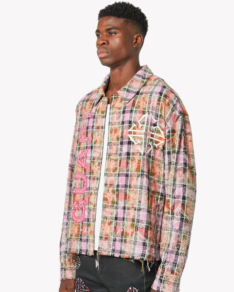 Man wearing a colorful plaid shirt with a white background
