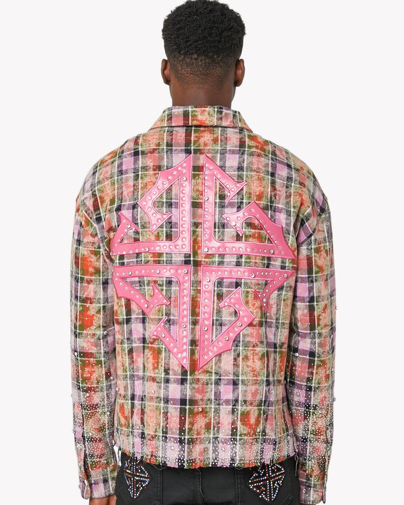 Person wearing a colorful plaid shirt with pink geometric design on the back, on a white background