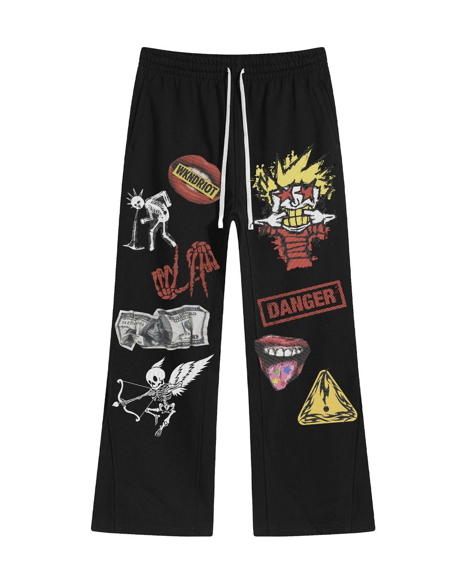 Black pants with various graphic designs on a white background