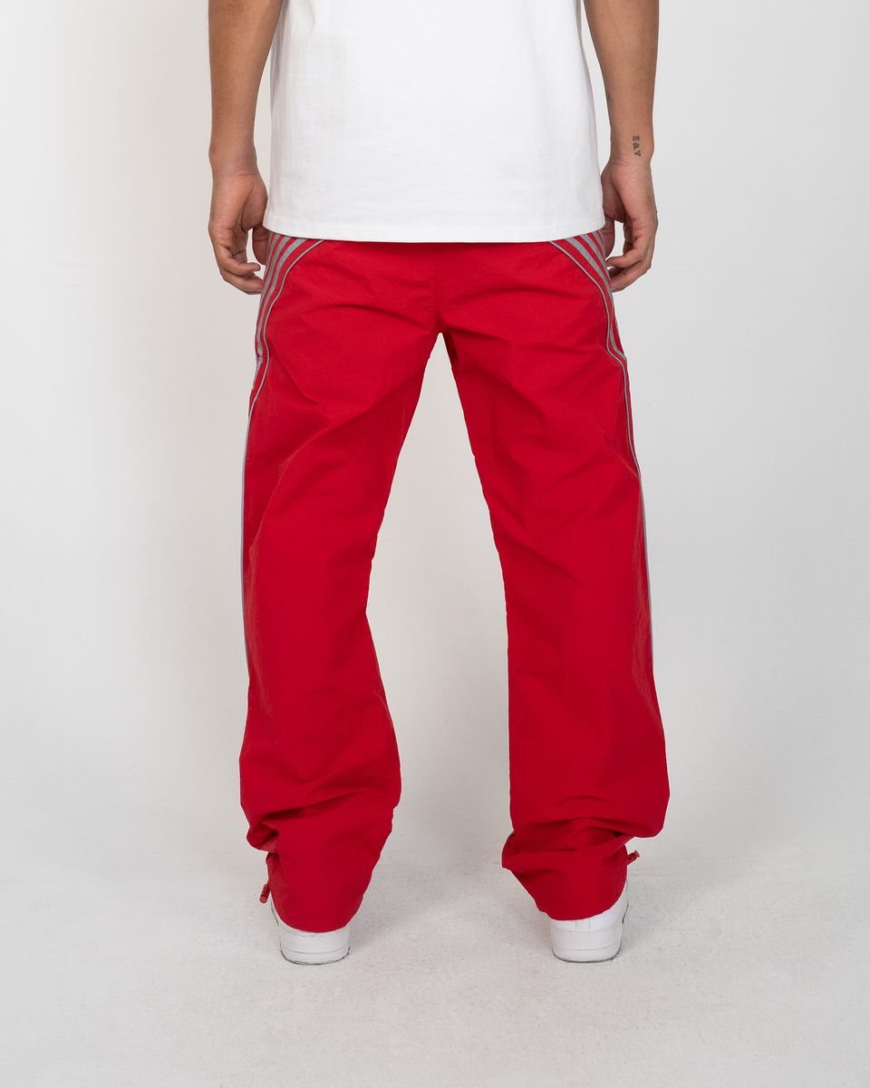 Red pants with white stripes on a plain background