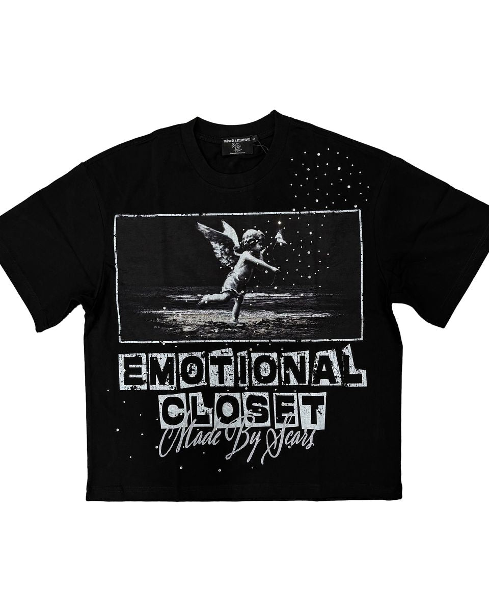 Black graphic shirt with angel imagery and phrase "emotional closet made by scars finished with rhinestone details.