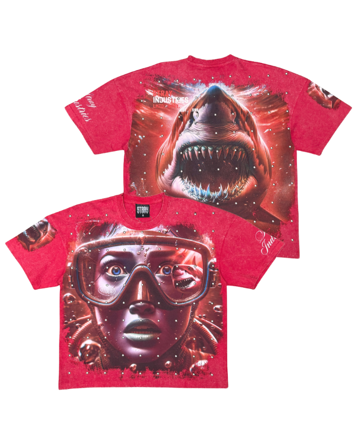Red t-shirt with a shark and diver graphic design on a white background