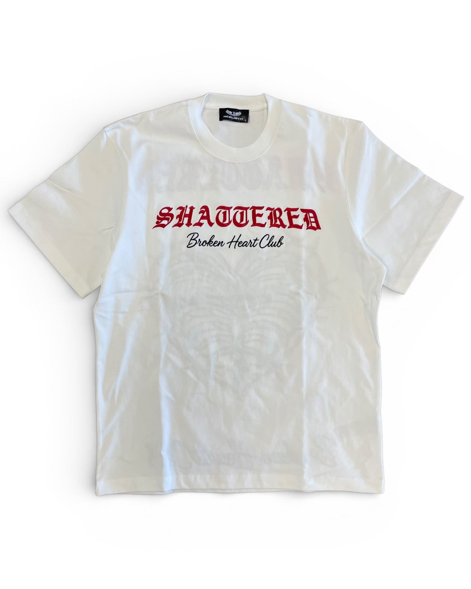 White t-shirt with red and black text on a white background