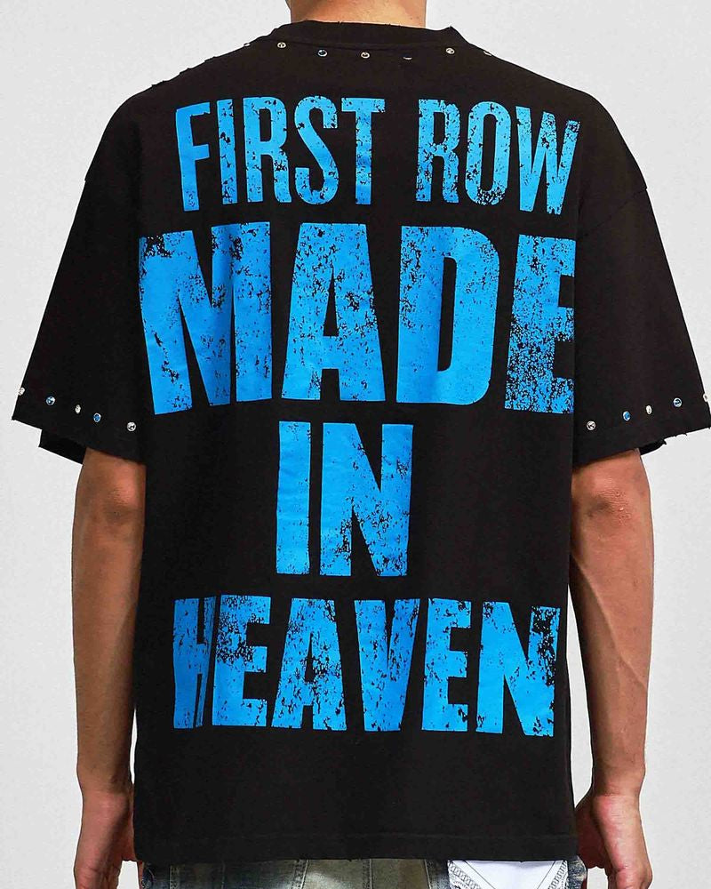 Black t-shirt with blue text 'FIRST ROW MADE IN HEAVEN' on a plain background