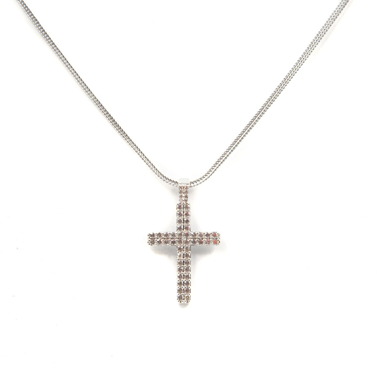 Silver cross pendant necklace on a white background