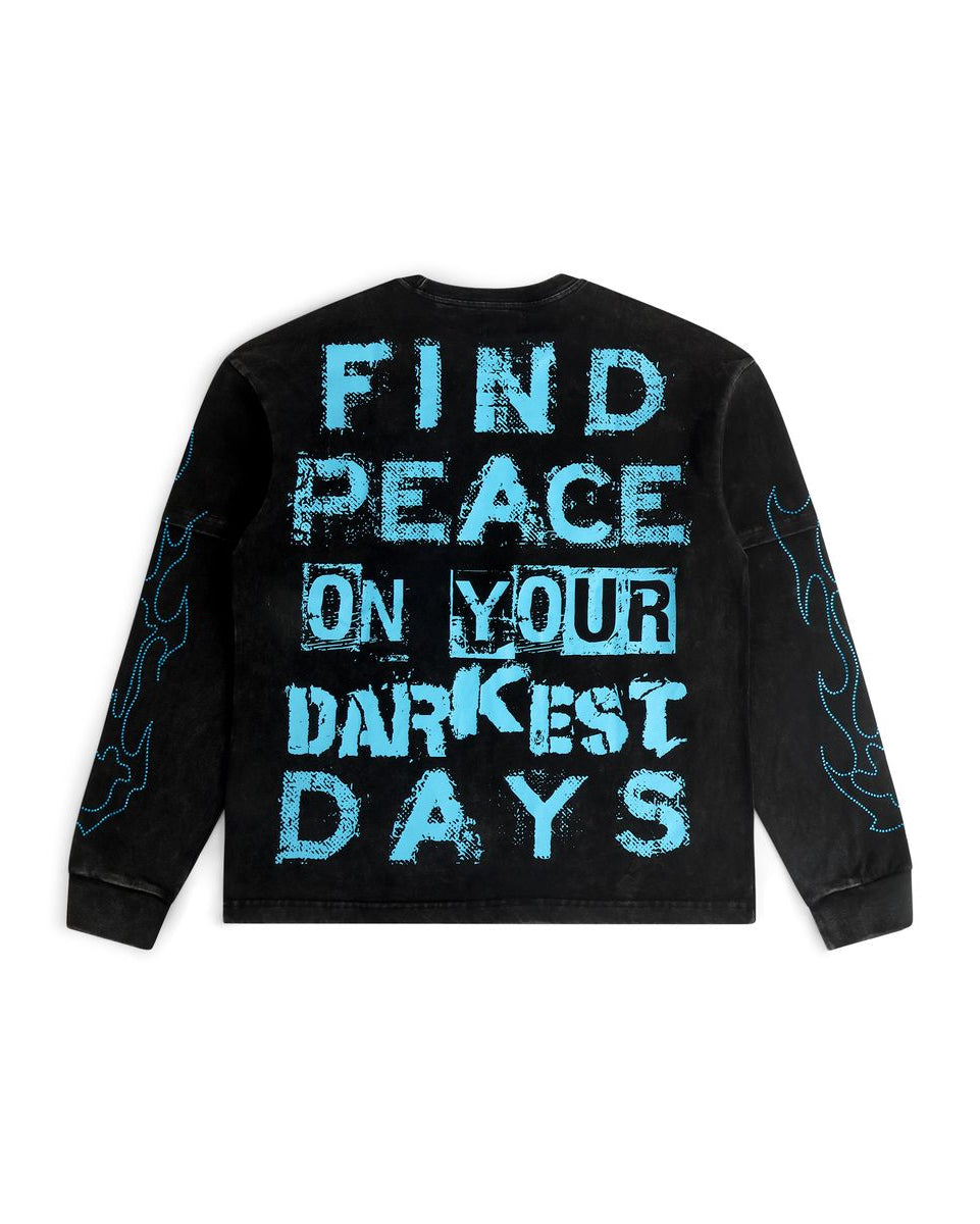 Black sweatshirt with blue text 'Find peace on your darkest days' on a white background