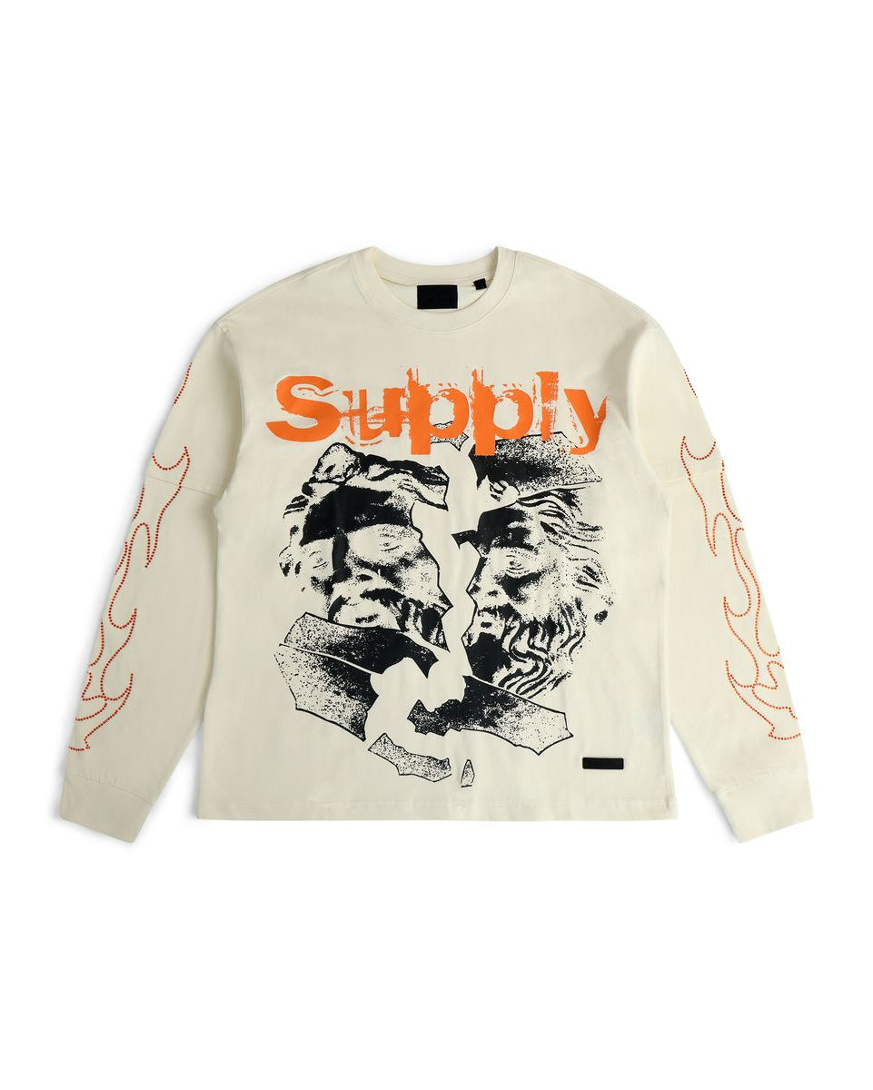 Beige long-sleeve shirt with graphic design and 'Supply' text on a white background