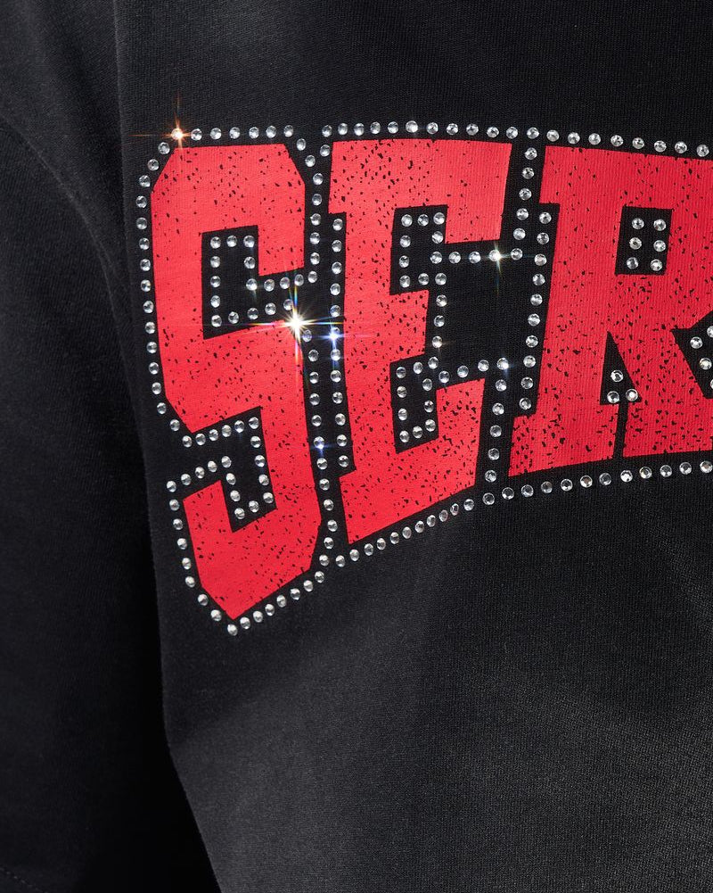 Black sweatshirt with red 'SER' text and rhinestone embellishments.