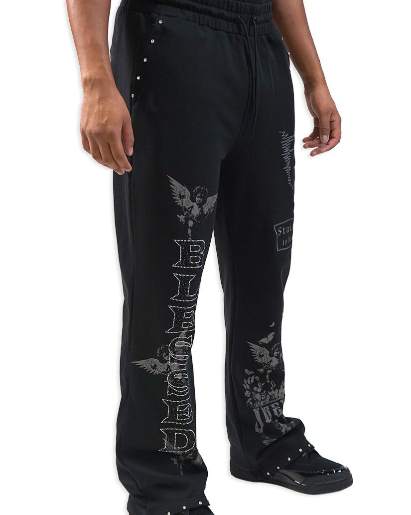 Black pants with decorative elements and text on a white background