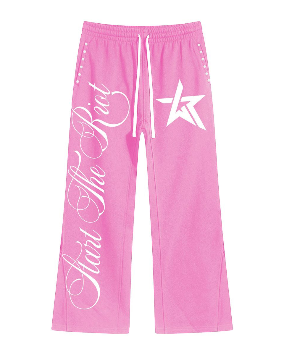 Pink pants with white text and star design on a white background