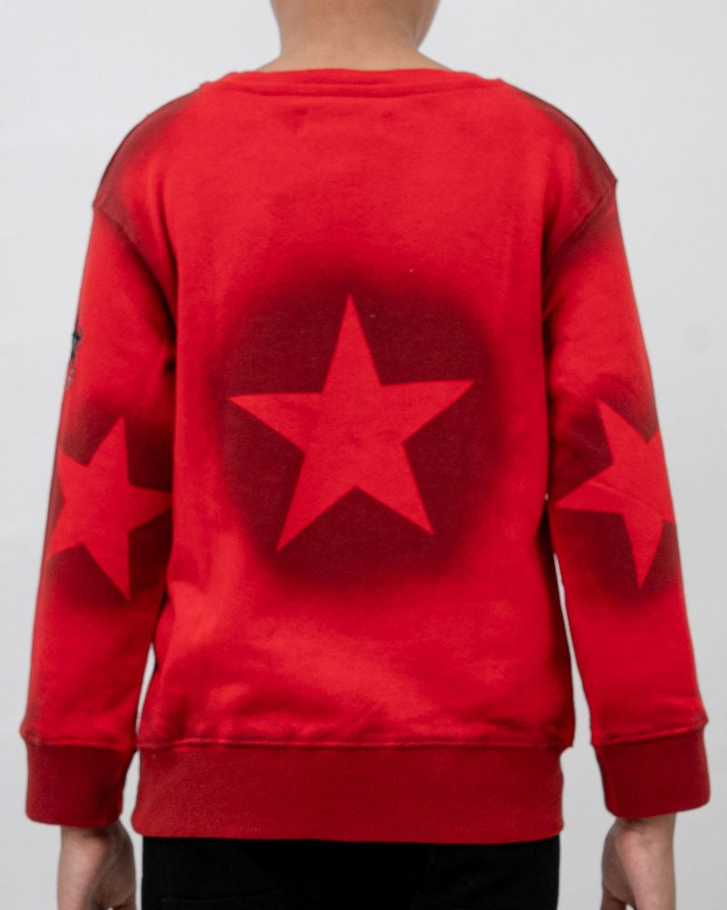 Red sweatshirt with a star design on the back against a plain background