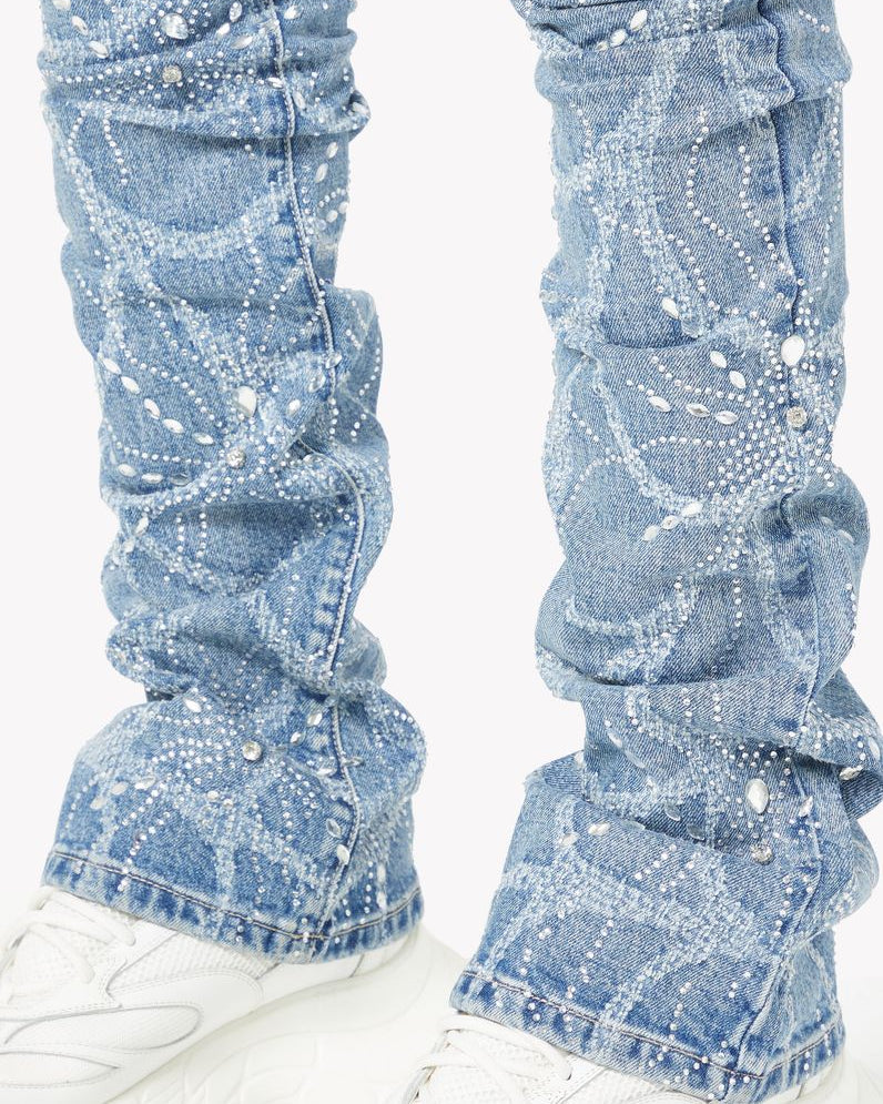 Blue denim leg warmers worn over white sneakers on a white background