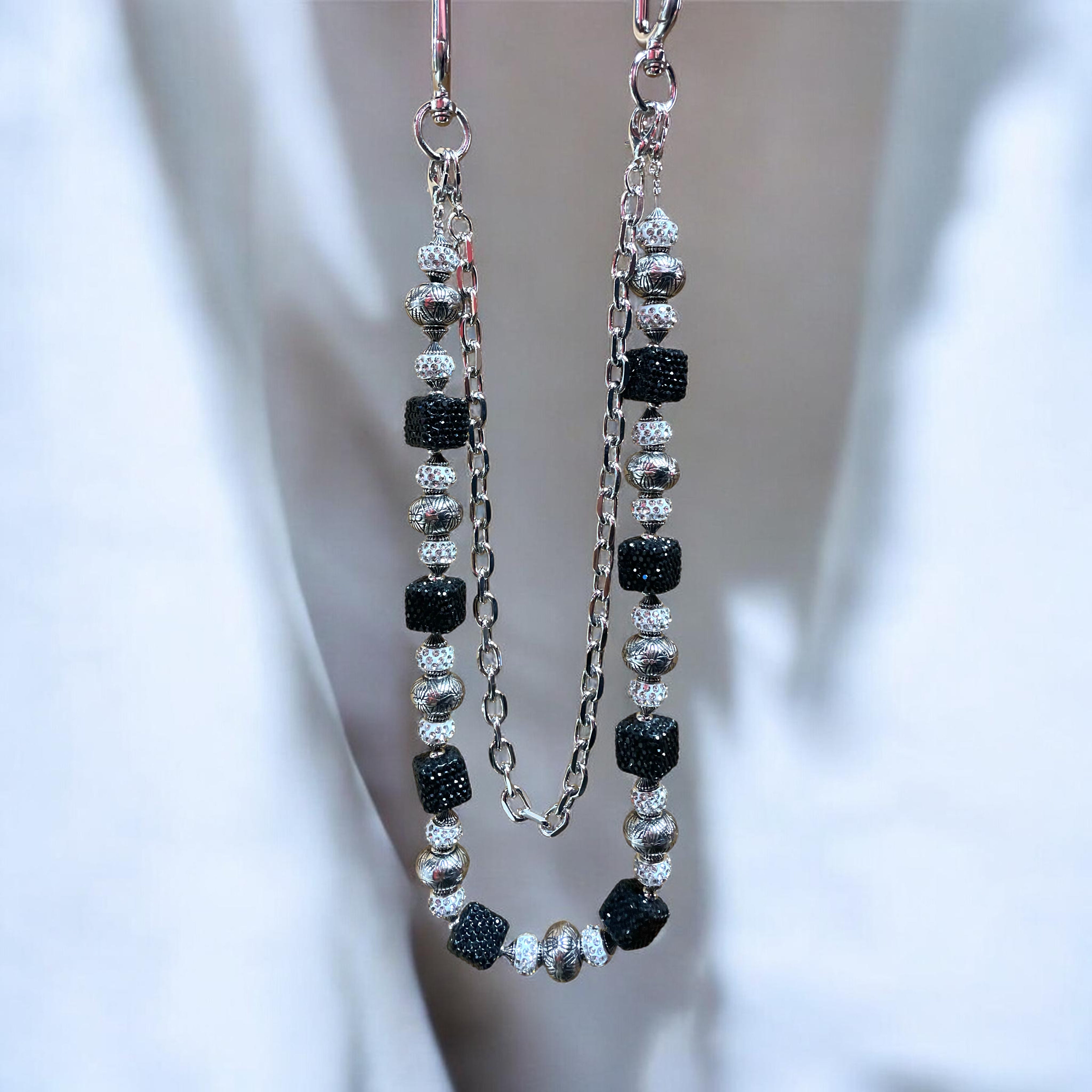 wallet chain with black and silver gems on a white background