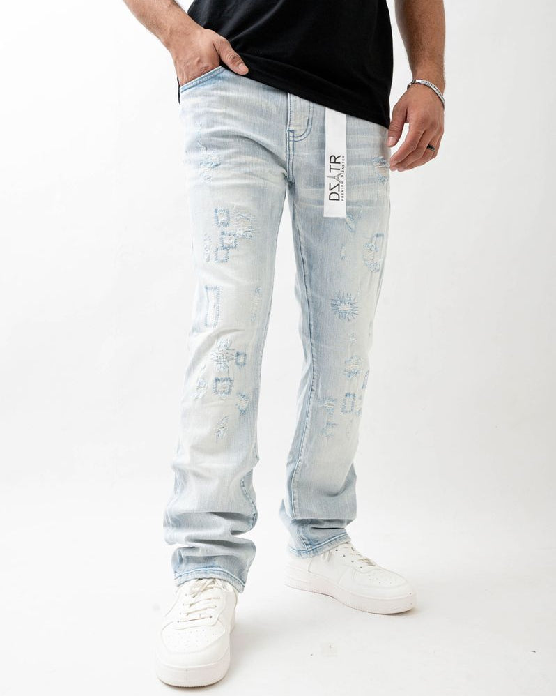 Person wearing light blue jeans with a brand logo on a white background