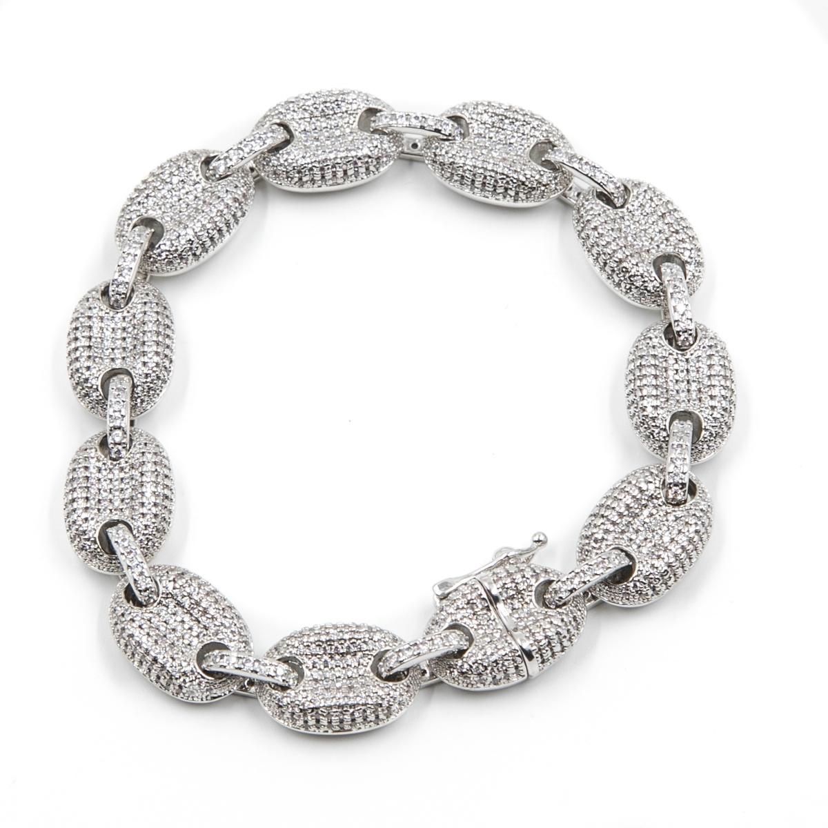 close up of the silver studded goochi bracelet on a white background