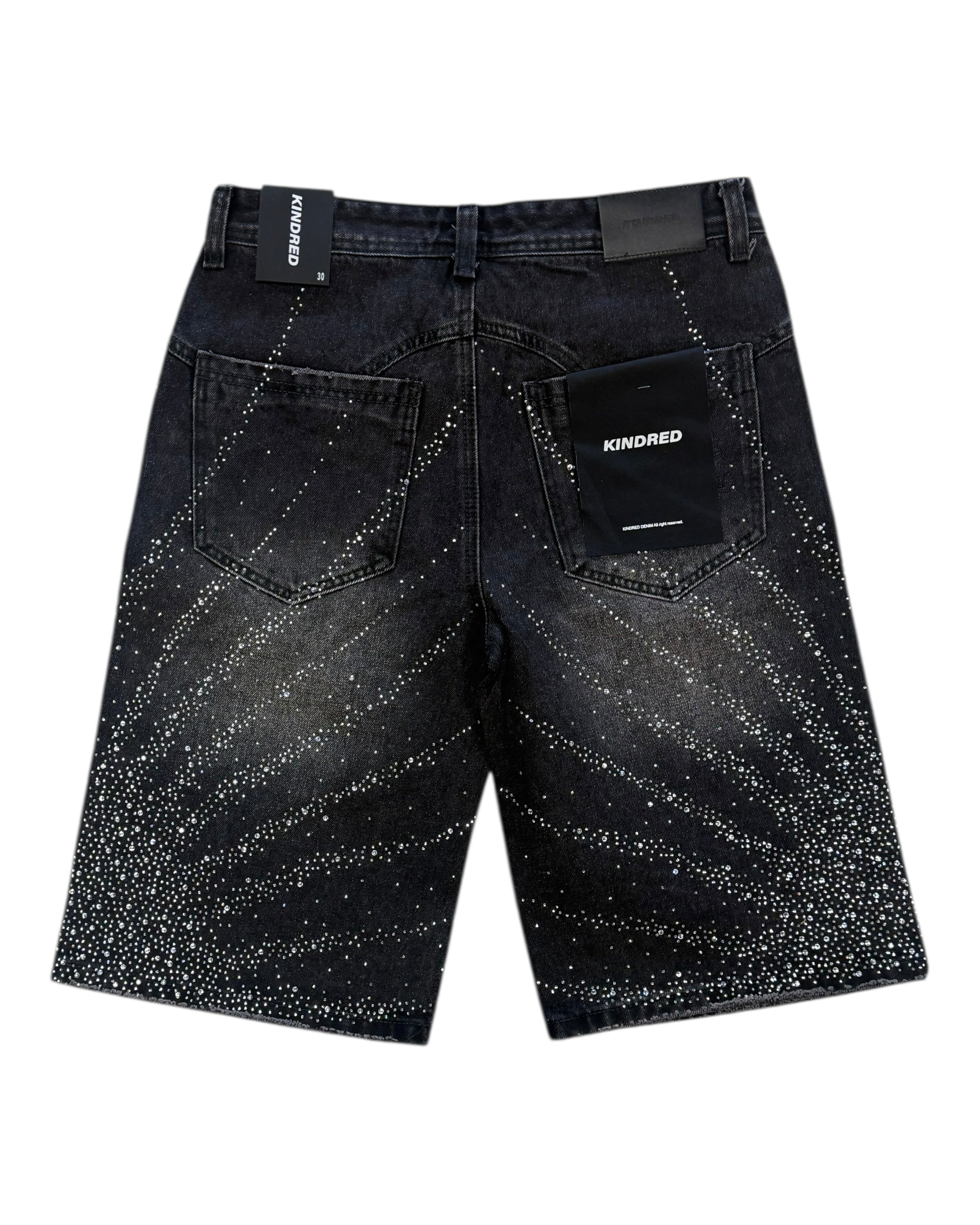Black denim shorts with speckled pattern on a white background
