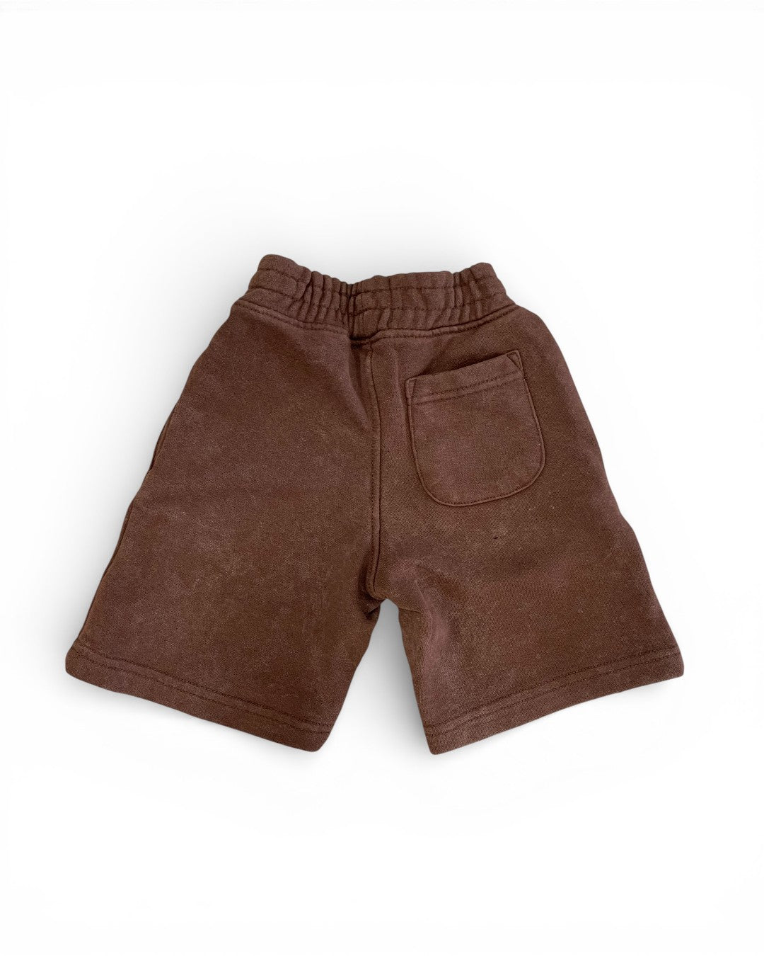 Brown shorts with a pocket on a white background