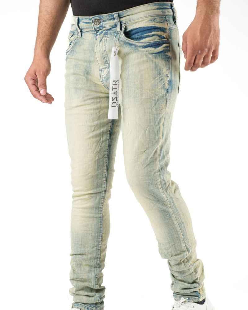 Light blue distressed jeans with a brand tag on a white background