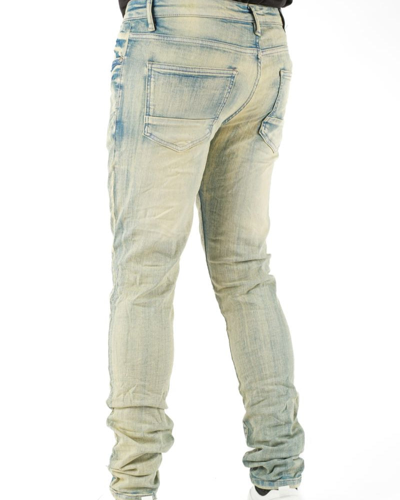 Light blue distressed jeans on a white background