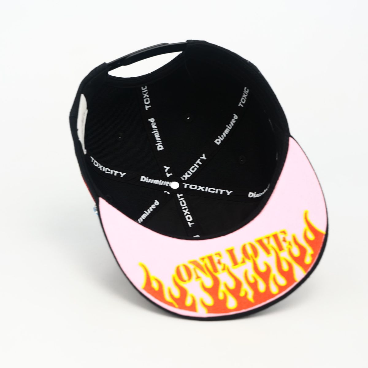 Black and pink cap with flame design and text on a white background