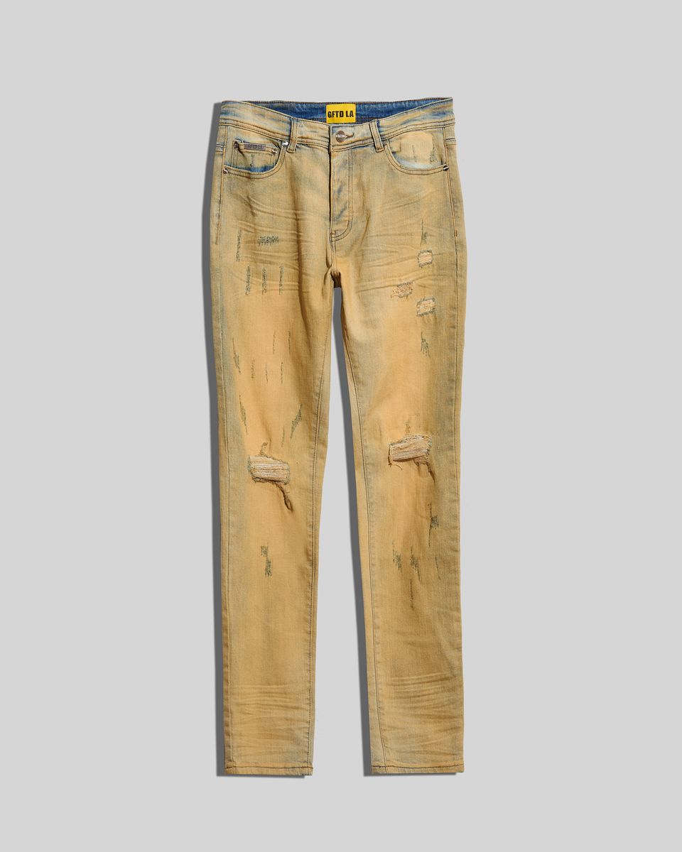 Tinted ripped jeans in a vintage blue color