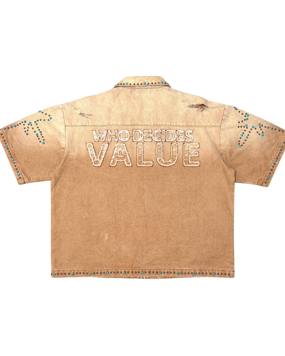 Beige shirt with 'WHO DECIDES VALUE' text on a white background