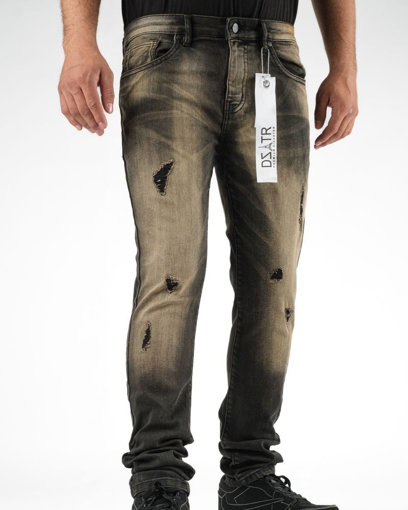 Distressed jeans with a brand tag on a white background