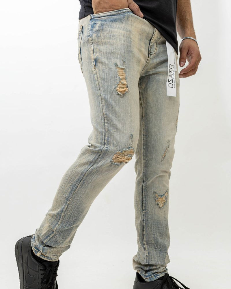 Distressed jeans with a brand label on a white background