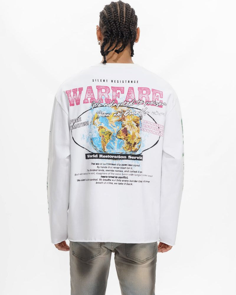 Person wearing a white long-sleeve shirt with graphics and text on the back, standing against a white background.