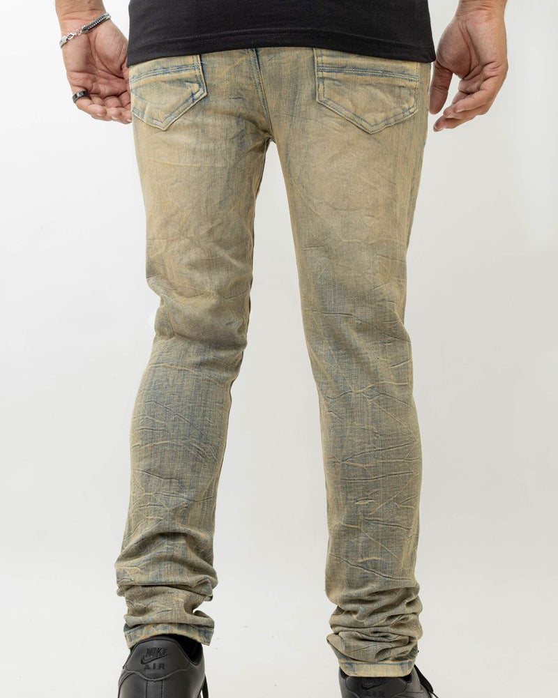 Person wearing light-colored distressed jeans on a white background
