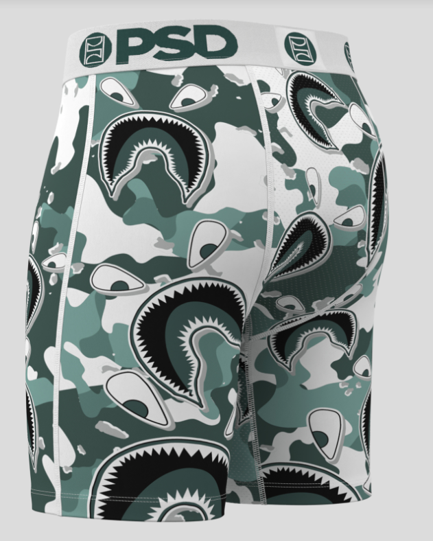 Green camouflage-patterned underwear with shark design on a white background