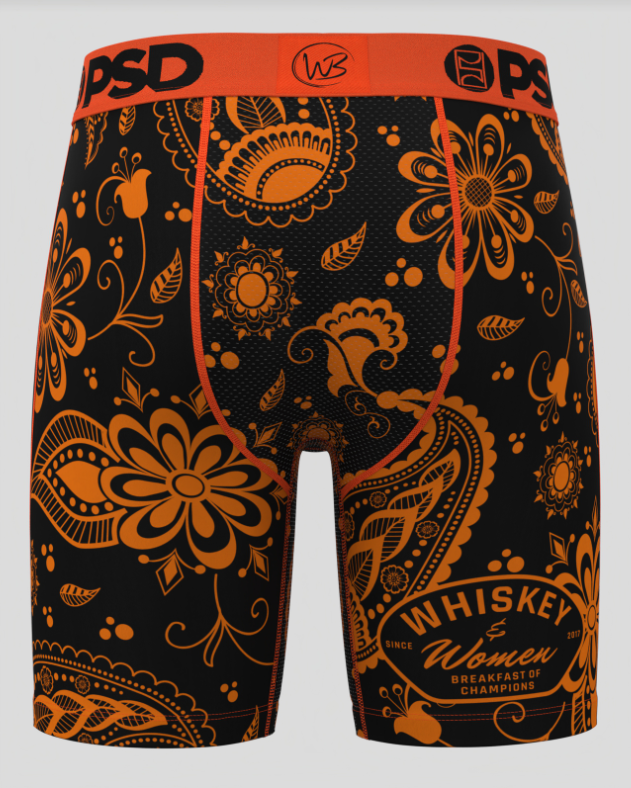 Black and orange patterned men's underwear with 'Whiskey & Women' text on a gray background