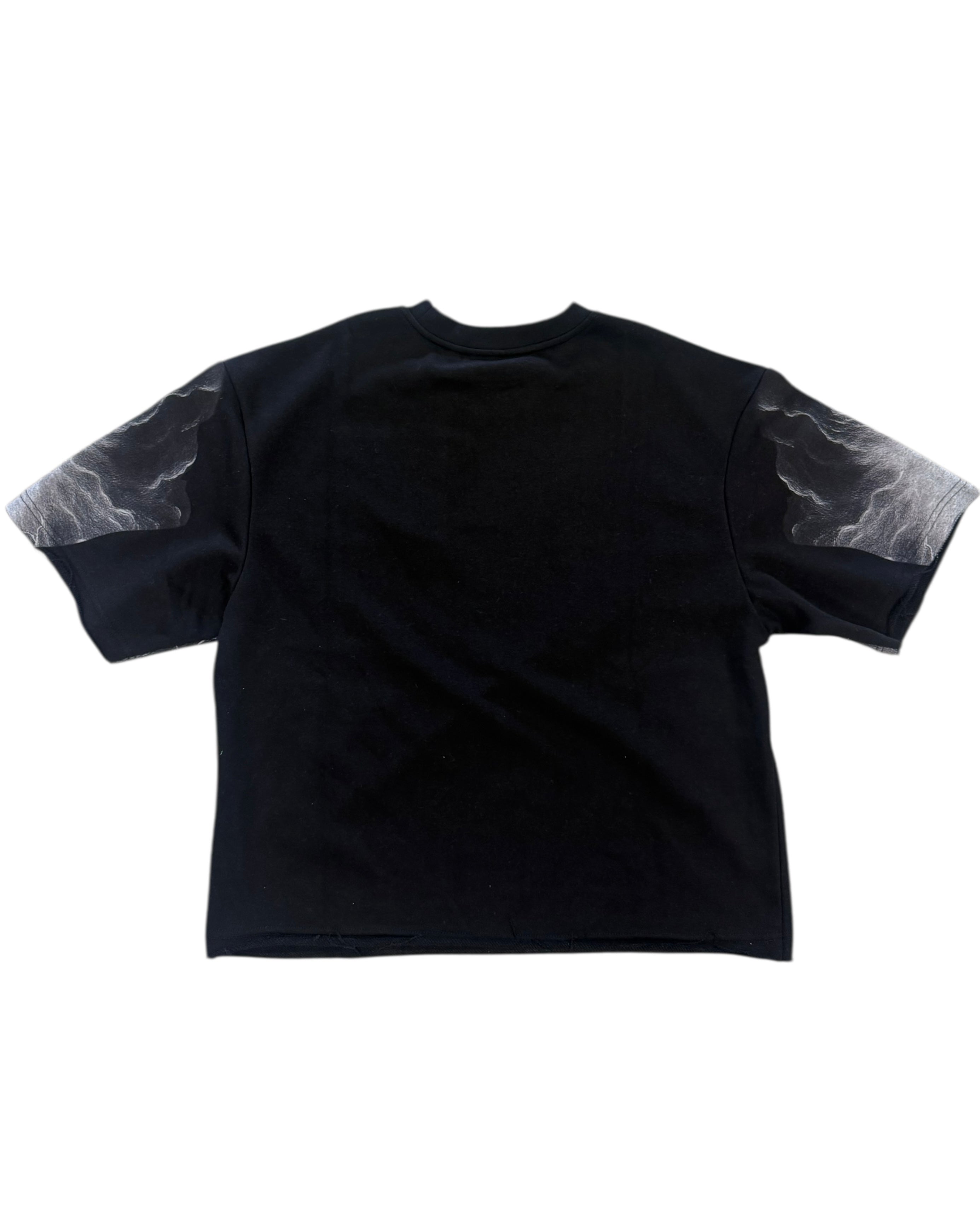 Black t-shirt with marble sleeve design on a white background
