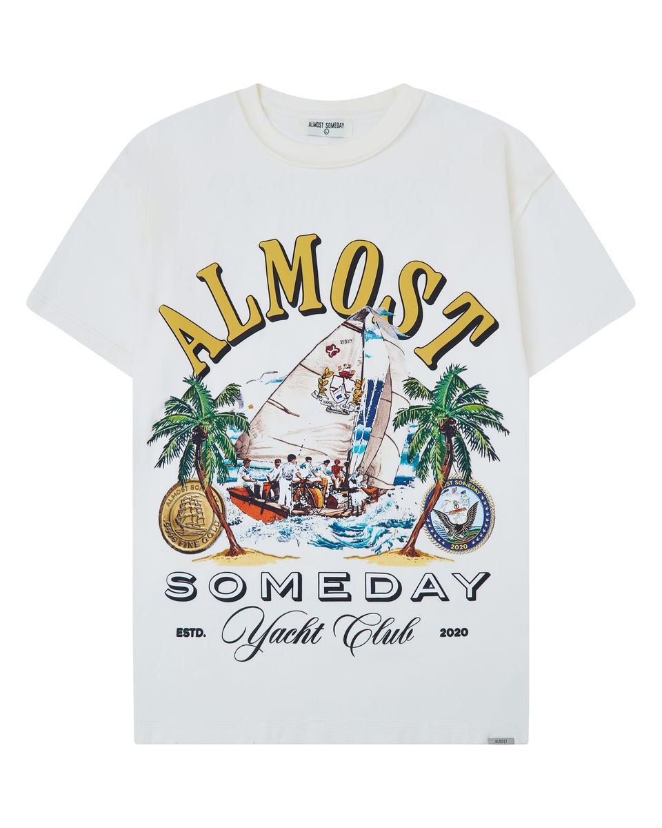 cream t-shirt with a sailboat graphic and 'Almost Someday Yacht Club' text on a white background